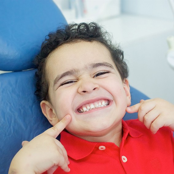 A smiling little boy at the dentist