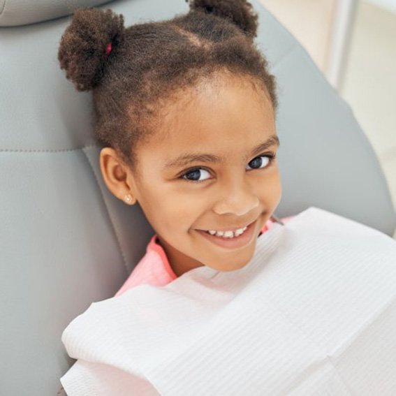 Smiling, happy child in dental treatment chair
