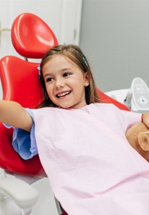 Child high-fiving pediatric dentist near Sandy Springs