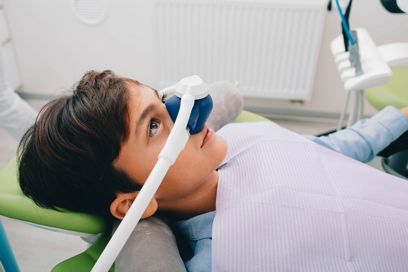 A little boy receiving dental sedation