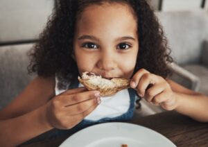 a child eating a bagel