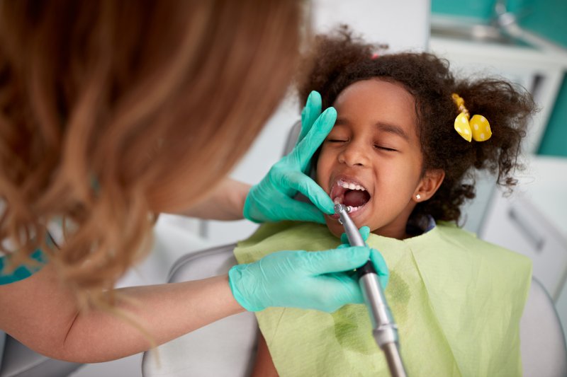 little girl undergoing a dental checkup