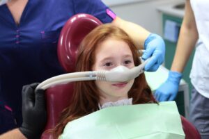 Young girl feeling relaxed at dentist with nitrous oxide