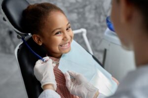 Child patient smiling at her dentist