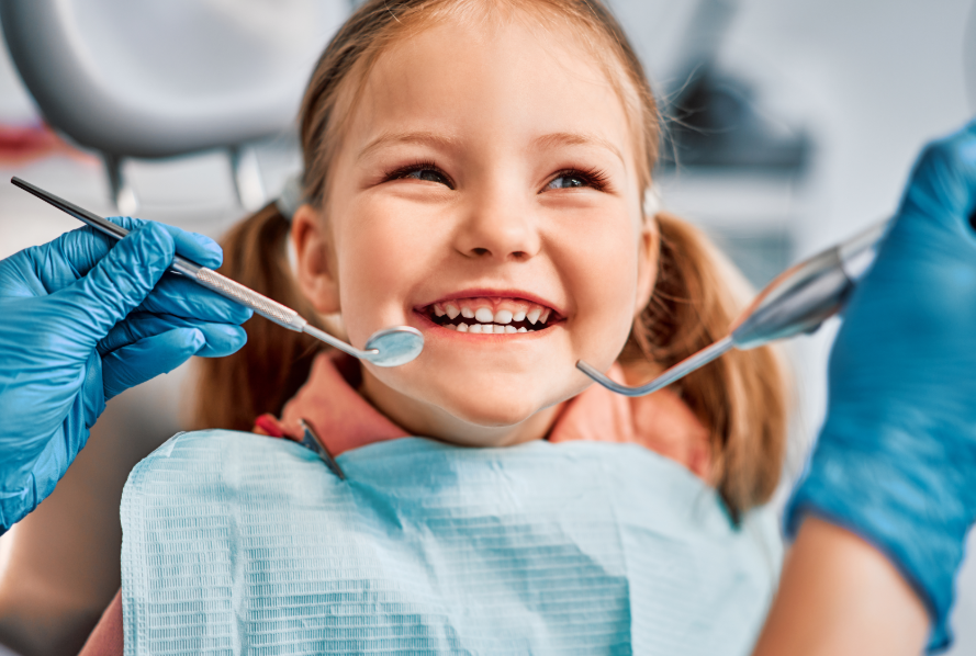 Child smiling at dental exam